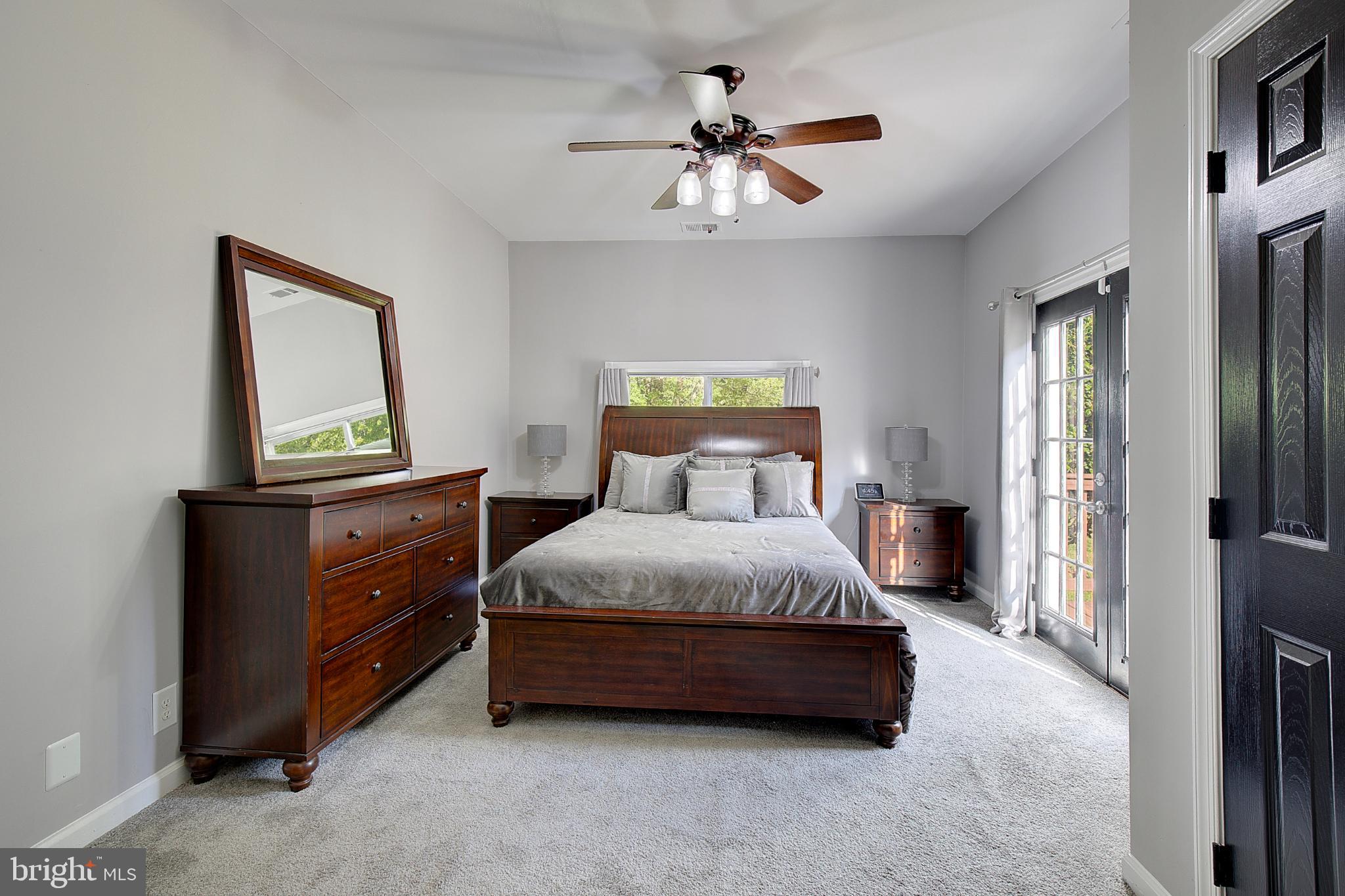 16811 Aquasco Road Brandywine, MD 20613 - Photo 22 of 34 Serene bedroom with natural light and charm.