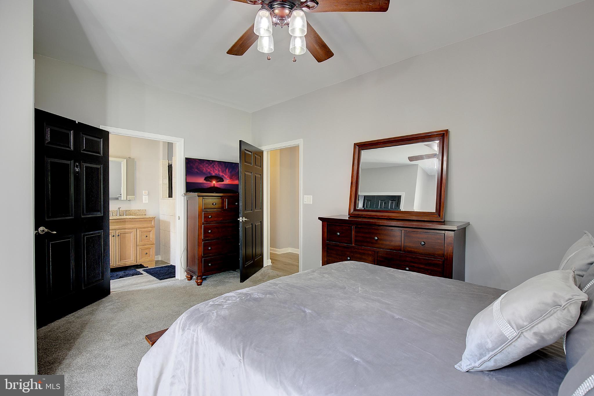 16811 Aquasco Road Brandywine, MD 20613 - Photo 23 of 34 Serene bedroom with modern elegance.