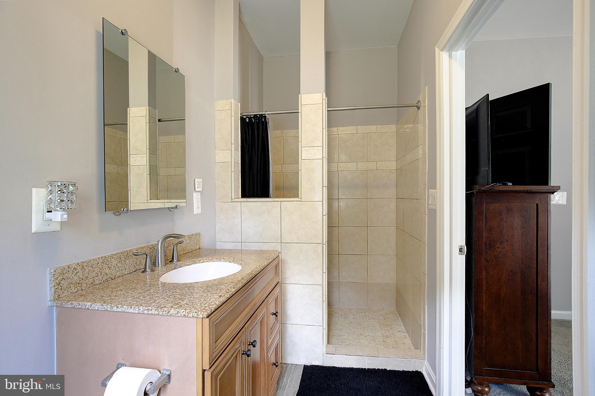 16811 Aquasco Road Brandywine, MD 20613 - Photo 25 of 34 Modern bathroom with elegant finishes.