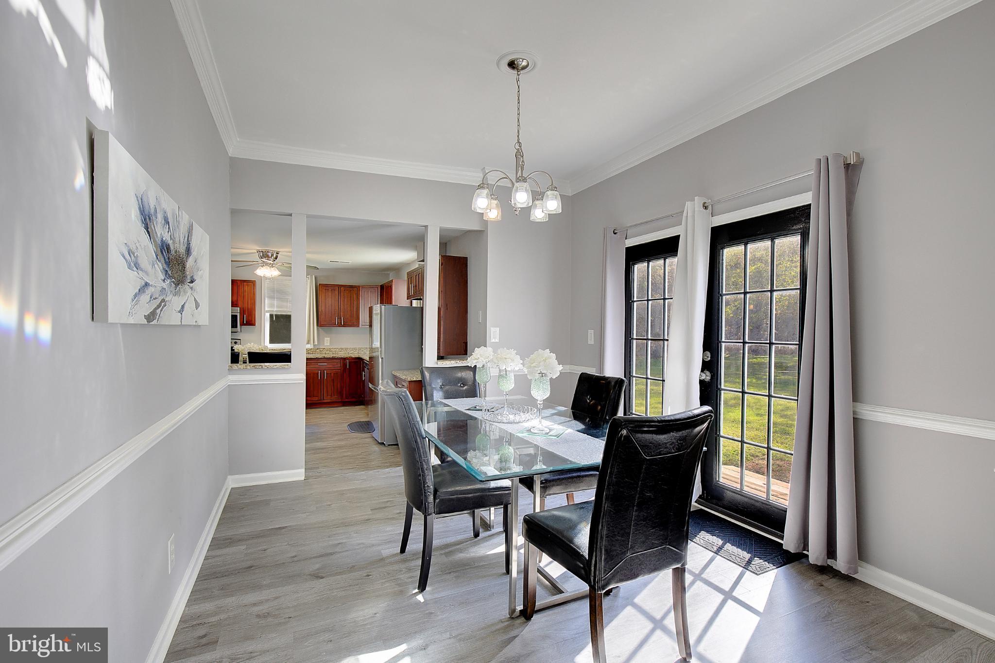 16811 Aquasco Road Brandywine, MD 20613 - Photo 6 of 34 Bright dining area with elegant glass table.