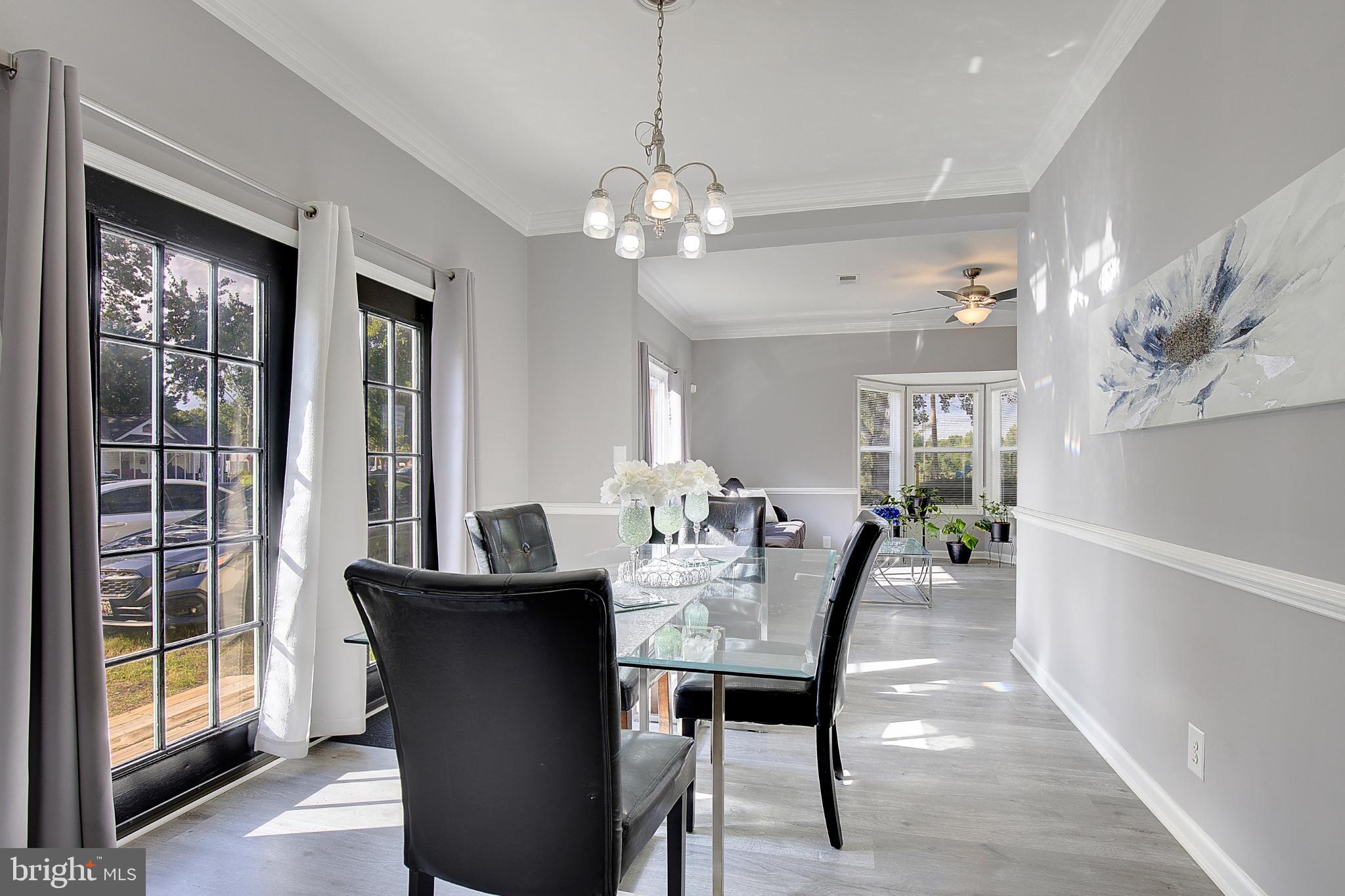 16811 Aquasco Road Brandywine, MD 20613 - Photo 7 of 34 Bright dining space with elegant lighting.