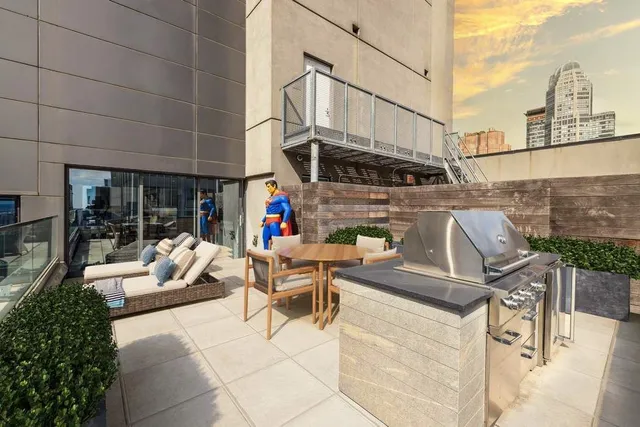 a view of city from balcony with seating space