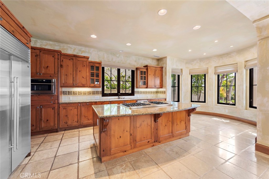 40 Timor Sea Newport Coast, CA 92657 - Photo 11 of 50 a kitchen with stainless steel appliances granite countertop a refrigerator and a sink