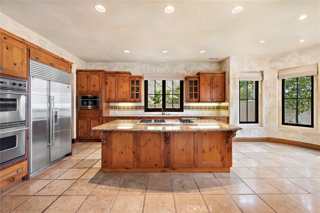 40 Timor Sea Newport Coast, CA 92657 - Photo 13 of 50 a view of a kitchen with stainless steel appliances granite countertop a stove and a refrigerator