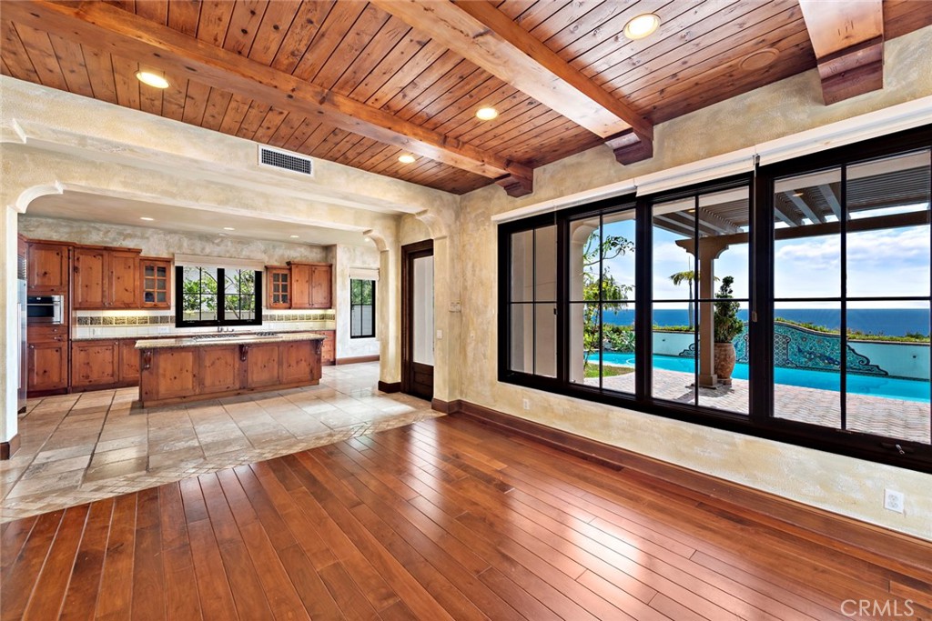40 Timor Sea Newport Coast, CA 92657 - Photo 16 of 50 a view of a big room with wooden floors and kitchen view