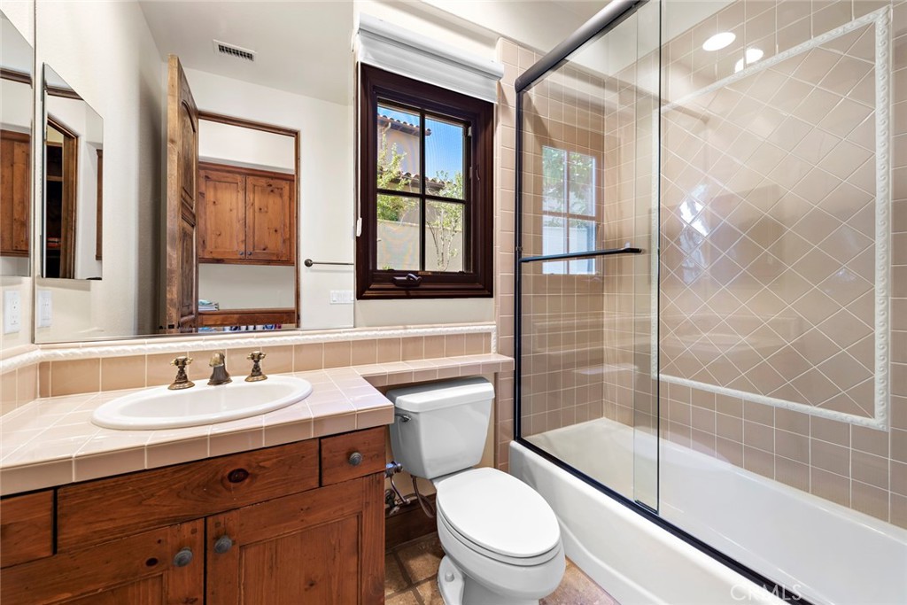 40 Timor Sea Newport Coast, CA 92657 - Photo 22 of 50 a bathroom with a shower sink vanity mirror and toilet
