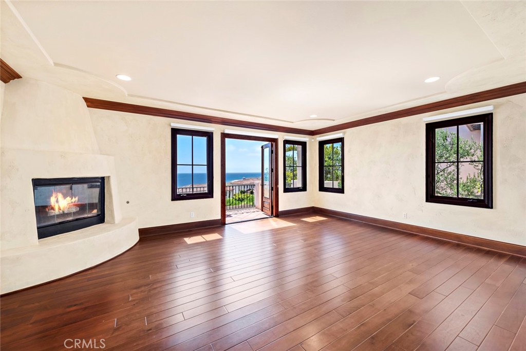 40 Timor Sea Newport Coast, CA 92657 - Photo 27 of 50 a view of an empty room with wooden floor and a window