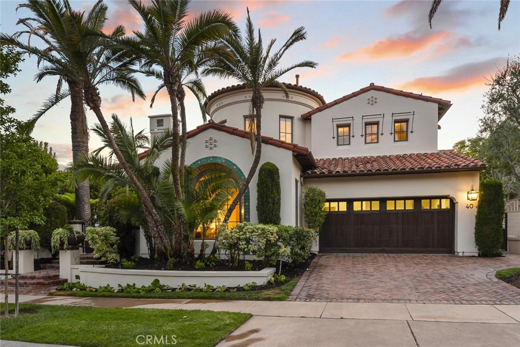 40 Timor Sea Newport Coast, CA 92657 - Photo 3 of 50 a view of white house with a big yard and palm trees