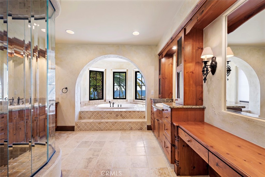 40 Timor Sea Newport Coast, CA 92657 - Photo 34 of 50 a large bathroom with double vanity sinks a large mirror and a bathtub