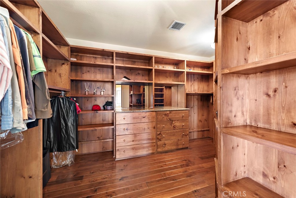 40 Timor Sea Newport Coast, CA 92657 - Photo 36 of 50 a view of walk in closet with clothes and shoes