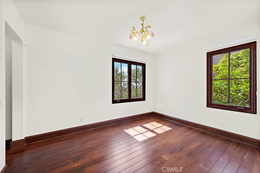 40 Timor Sea Newport Coast, CA 92657 - Photo 37 of 50 a view of an empty room with wooden floor and a window
