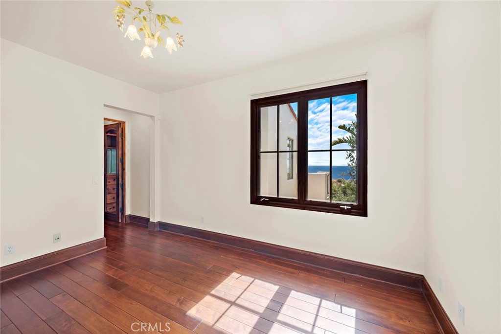 40 Timor Sea Newport Coast, CA 92657 - Photo 38 of 50 a view of an empty room with wooden floor and a window