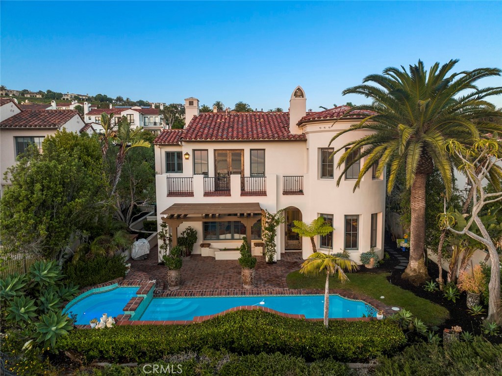 40 Timor Sea Newport Coast, CA 92657 - Photo 47 of 50 front view of a house with a swimming pool