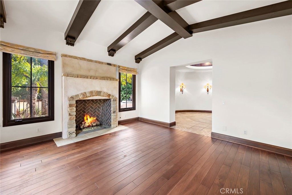 40 Timor Sea Newport Coast, CA 92657 - Photo 6 of 50 a view of an empty room with wooden floor fireplace and a window