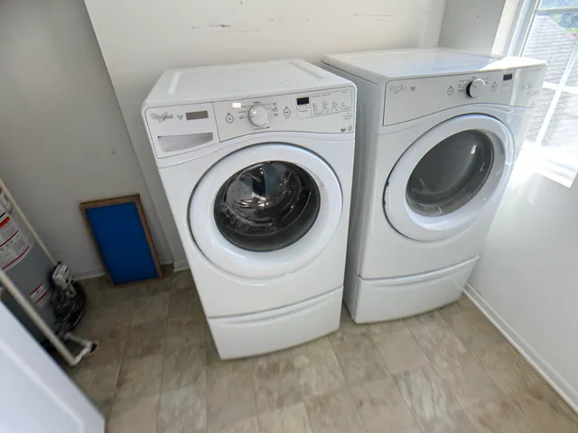 a utility room with dryer and washer