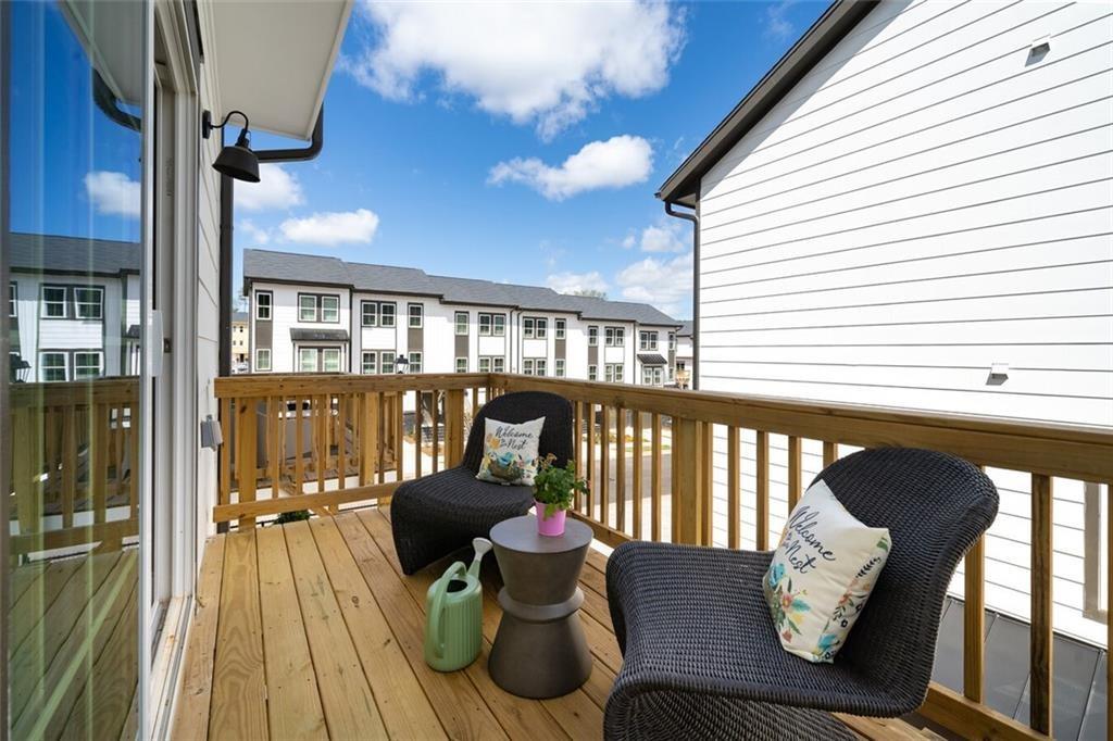 3960 Redan Road, Unit B1 Stone Mountain, GA 30083 - Photo 18 of 23 a view of a balcony with chairs
