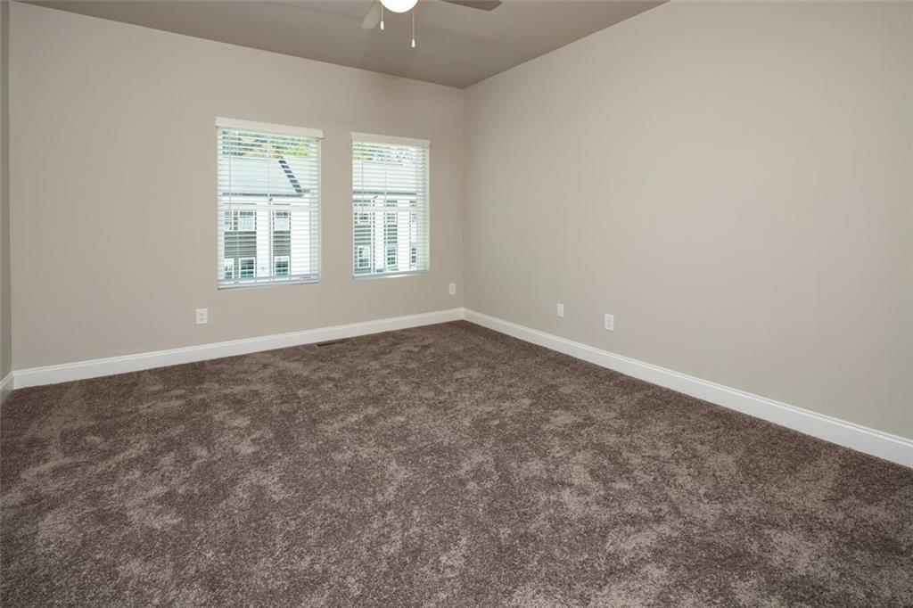 3960 Redan Road, Unit B1 Stone Mountain, GA 30083 - Photo 19 of 23 an empty room with windows