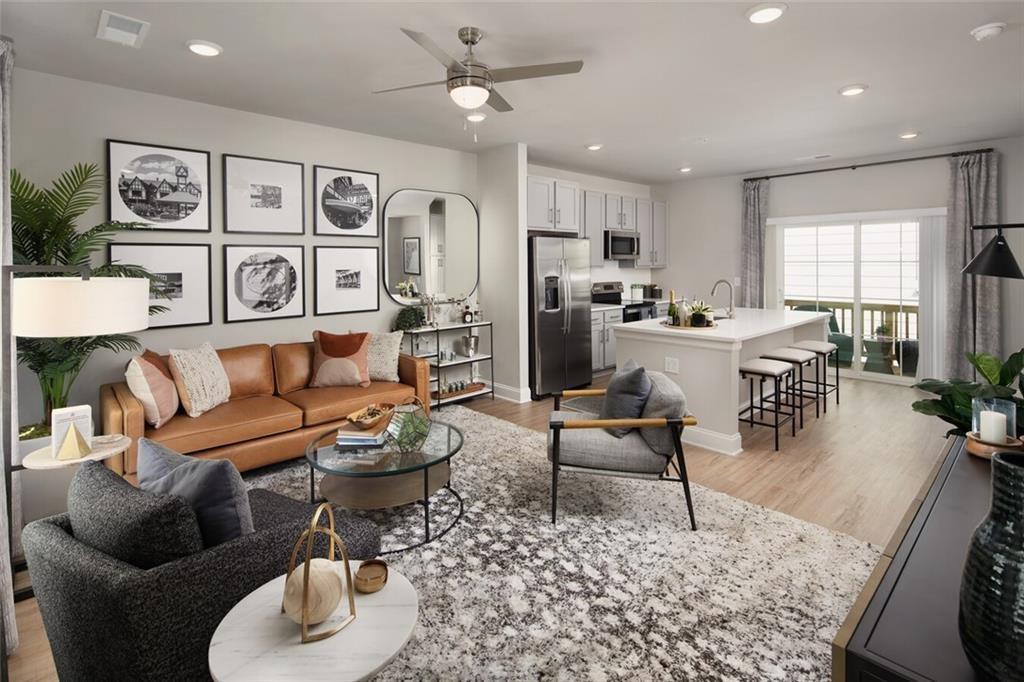 3960 Redan Road, Unit B1 Stone Mountain, GA 30083 - Photo 2 of 23 a living room with furniture potted plant and open kitchen view