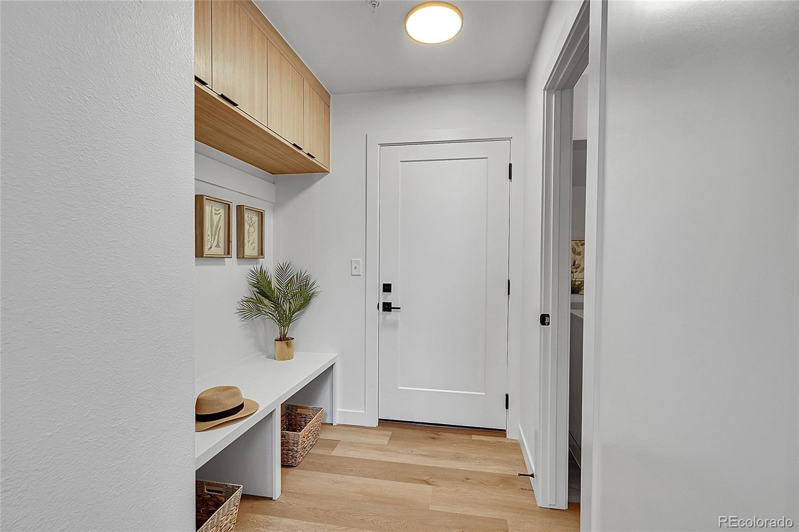 765 East County Line Road Erie, CO 80516 - Photo 10 of 28 a view of an entryway with wooden floor