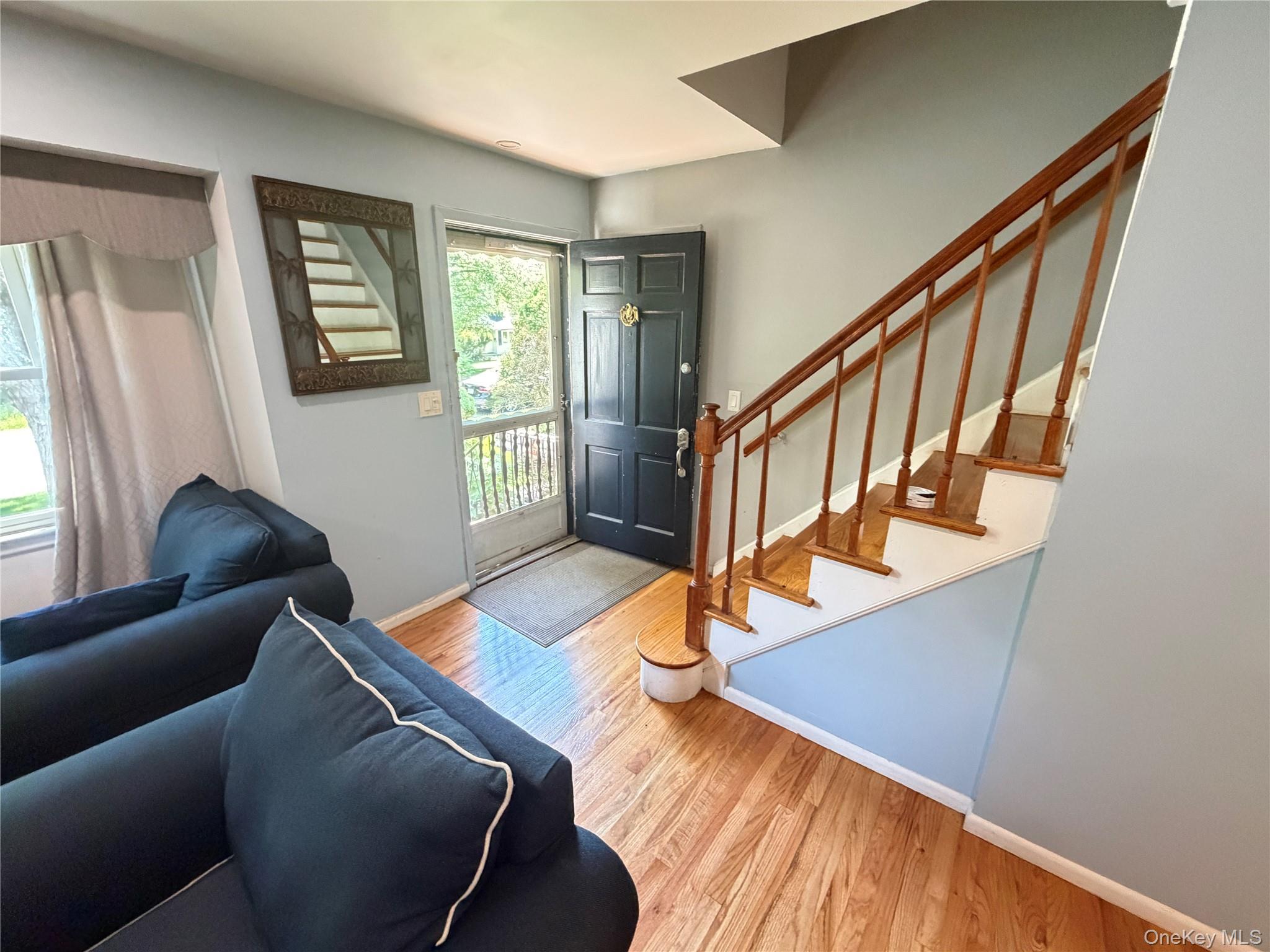 17 Mallory Road Spring Valley, NY 10977 - Photo 13 of 26 a living room with wooden floor and stairs