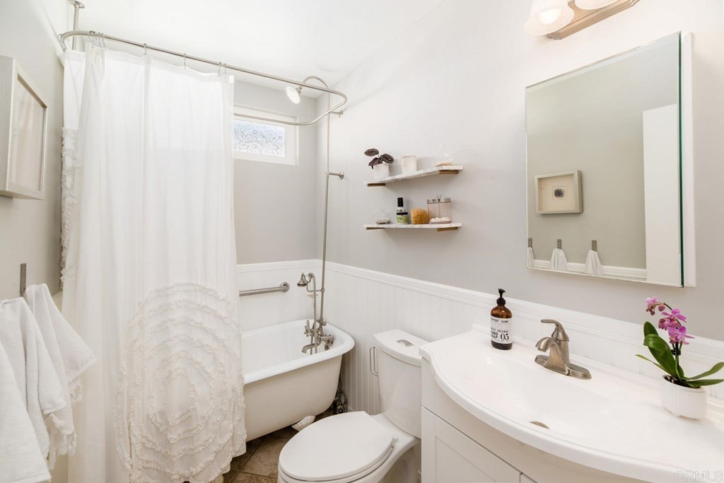 220 Coneflower Street Encinitas, CA 92024 - Photo 11 of 25 a bathroom with a sink toilet and shower