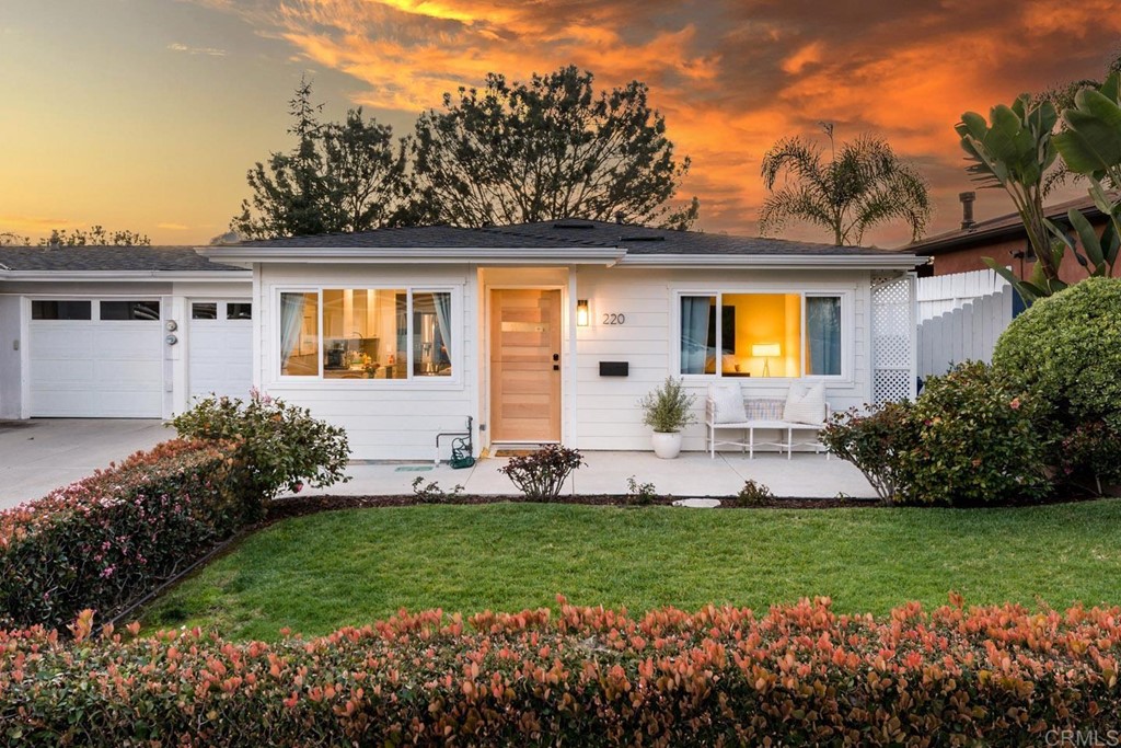220 Coneflower Street Encinitas, CA 92024 - Photo 20 of 25 a front view of a house with a garden and plants