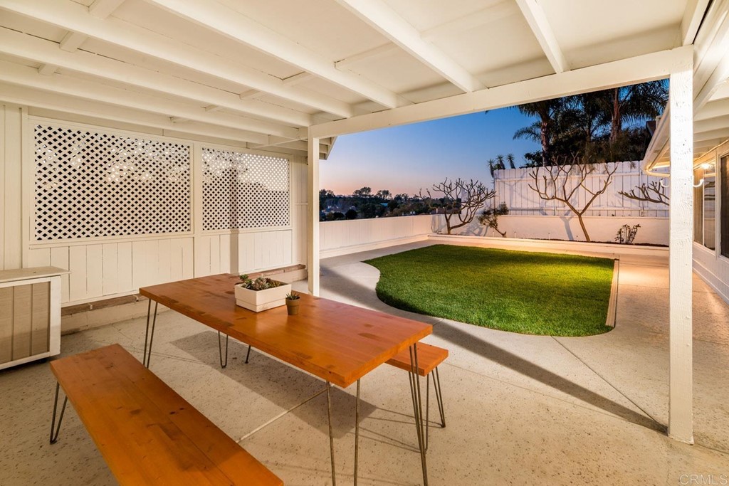 220 Coneflower Street Encinitas, CA 92024 - Photo 22 of 25 a living room with furniture and a flat screen tv