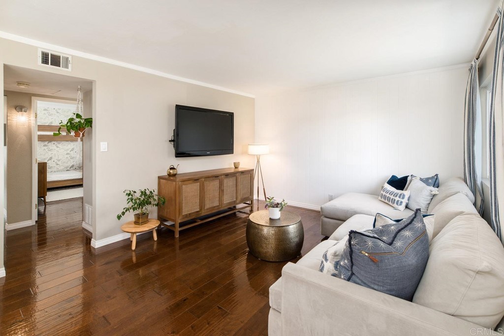 220 Coneflower Street Encinitas, CA 92024 - Photo 7 of 25 a living room with furniture and a flat screen tv