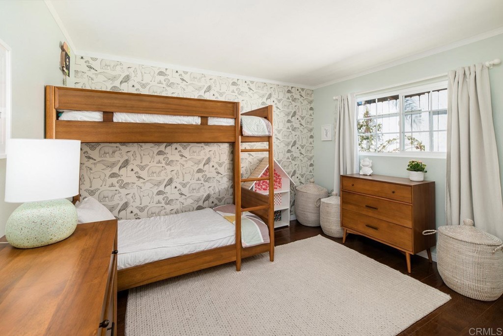 220 Coneflower Street Encinitas, CA 92024 - Photo 9 of 25 a bedroom with a bed and a window