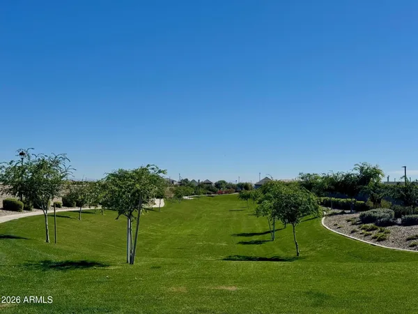 a view of a garden with a house