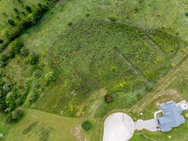a view of a yard from a balcony