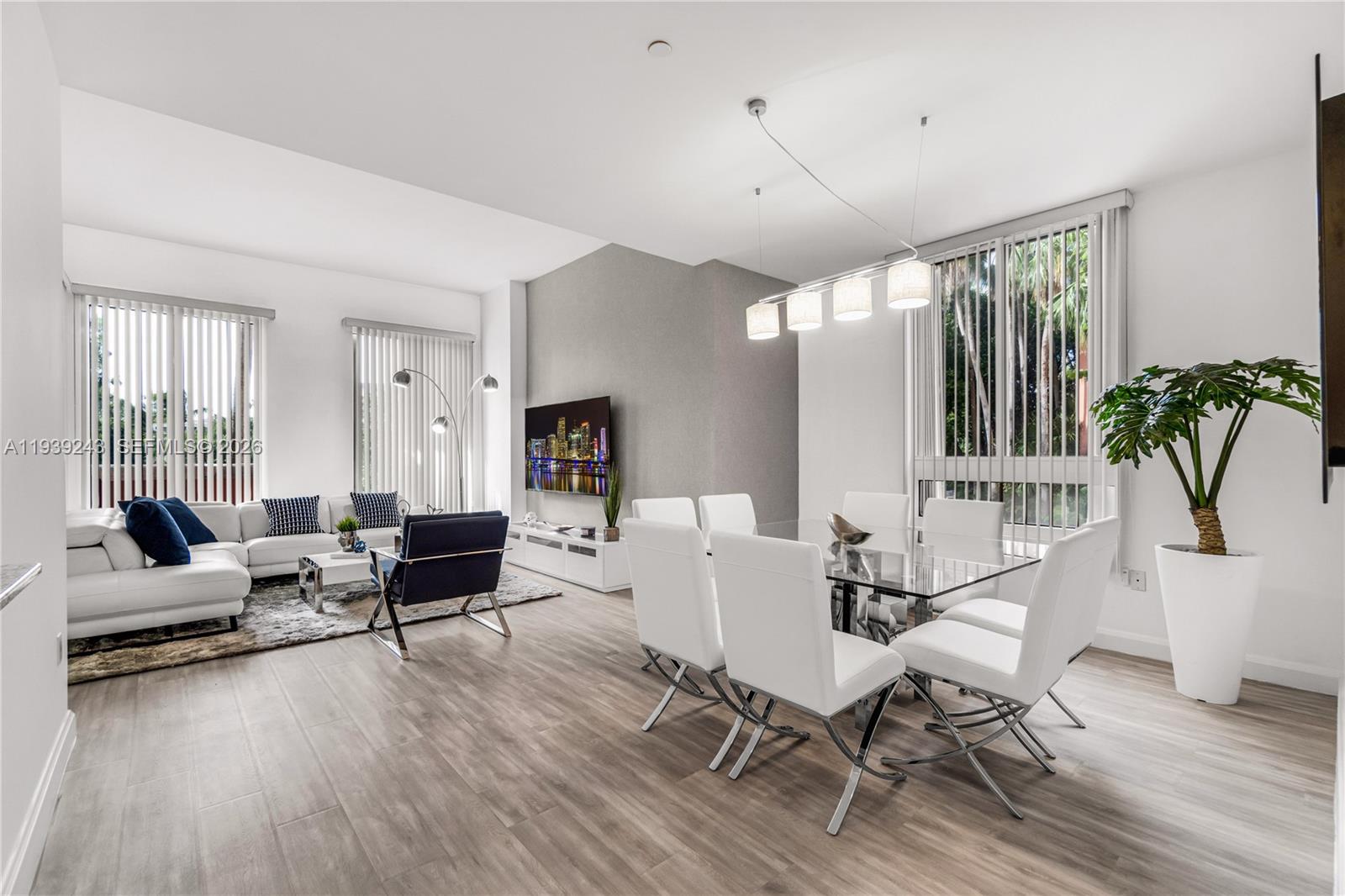 785 Crandon Boulevard, Unit 106 Key Biscayne, FL 33149 - Photo 1 of 22 a living room with furniture and a wooden floor