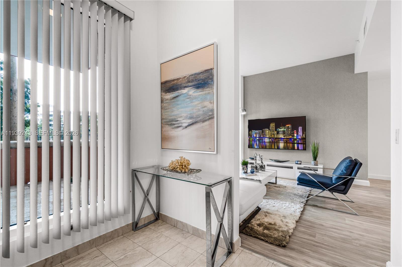 785 Crandon Boulevard, Unit 106 Key Biscayne, FL 33149 - Photo 2 of 22 a living room with furniture and a flat screen tv