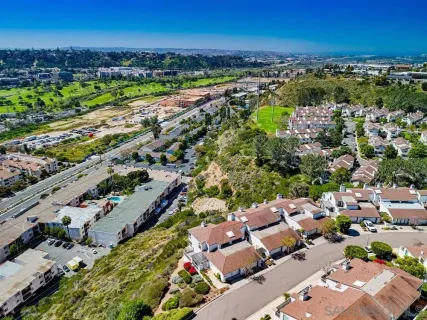 an aerial view of a city with lots of residential buildings
