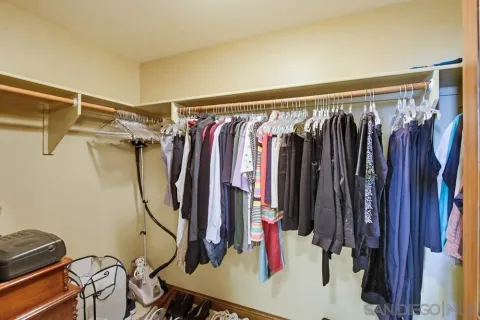 a view of a bedroom with a workspace