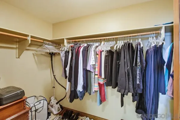 a view of a bedroom with a workspace