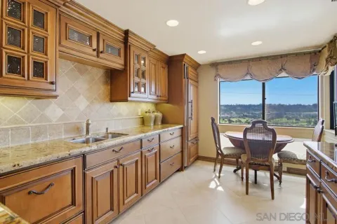 a view of a kitchen with granite countertop lots of counter top space and furniture
