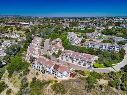a path view of a house with a yard