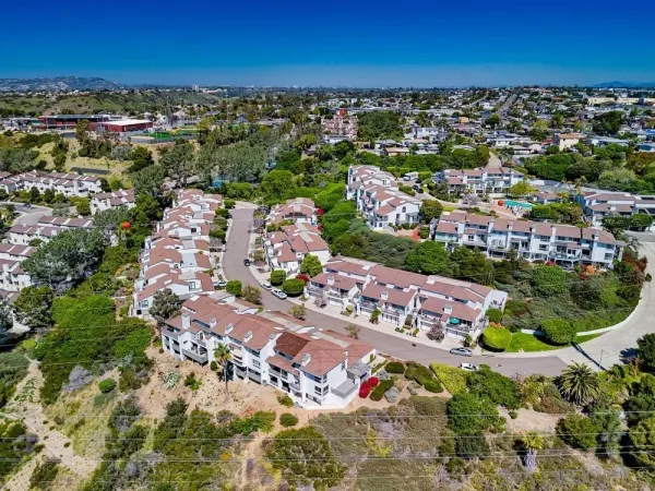 a path view of a house with a yard