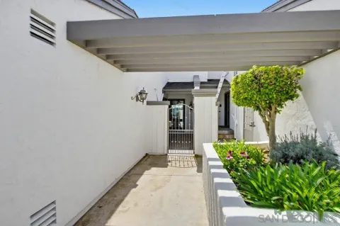 a view of a swimming pool and front of house
