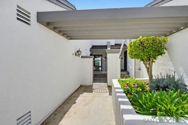 a view of a swimming pool and front of house