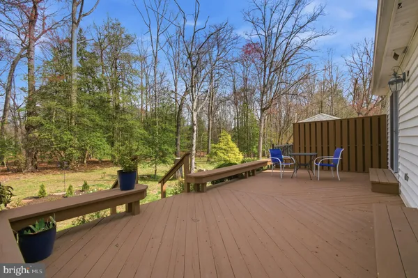 a view of outdoor space with seating area and trees