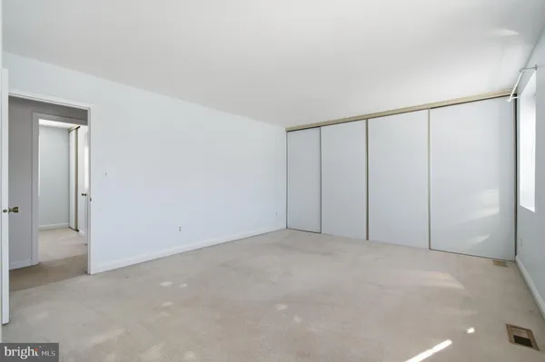 a bathroom with a shower and a sink