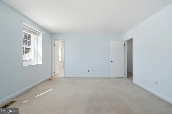 a black and white photo of a living room