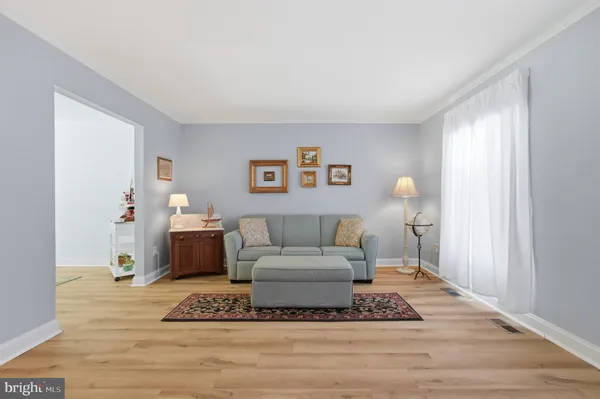a living room with furniture and a rug