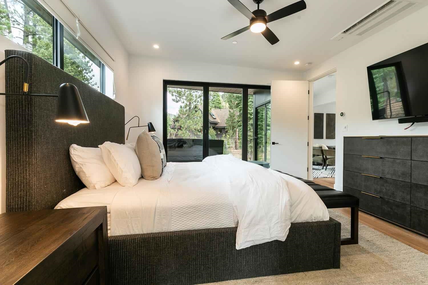 342 Palisades Circle, Unit SHARE 2 Olympic Valley, CA 96146 - Photo 15 of 28 a bedroom with a large bed and a flat tv screen