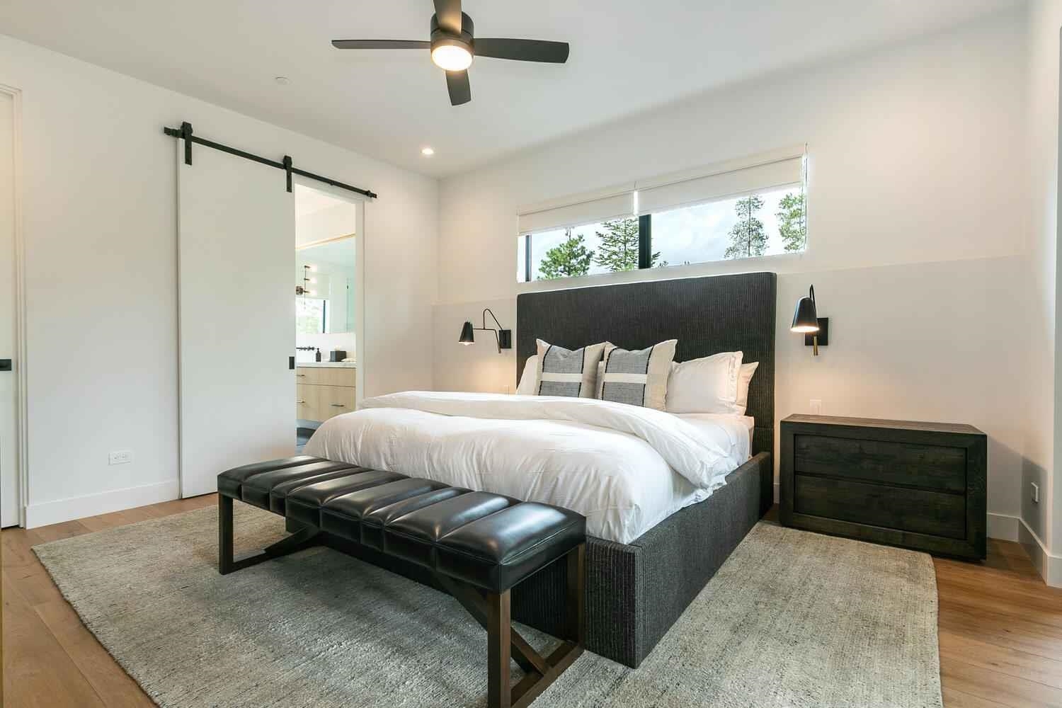 342 Palisades Circle, Unit SHARE 2 Olympic Valley, CA 96146 - Photo 16 of 28 a spacious bedroom with a bed and a chandelier