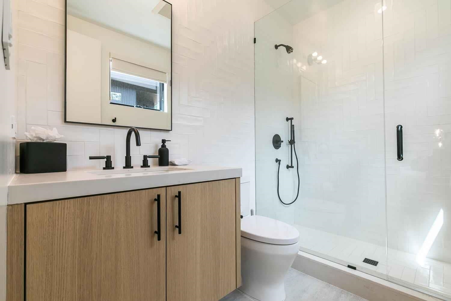 342 Palisades Circle, Unit SHARE 2 Olympic Valley, CA 96146 - Photo 23 of 28 a bathroom with a granite countertop toilet a sink and a mirror