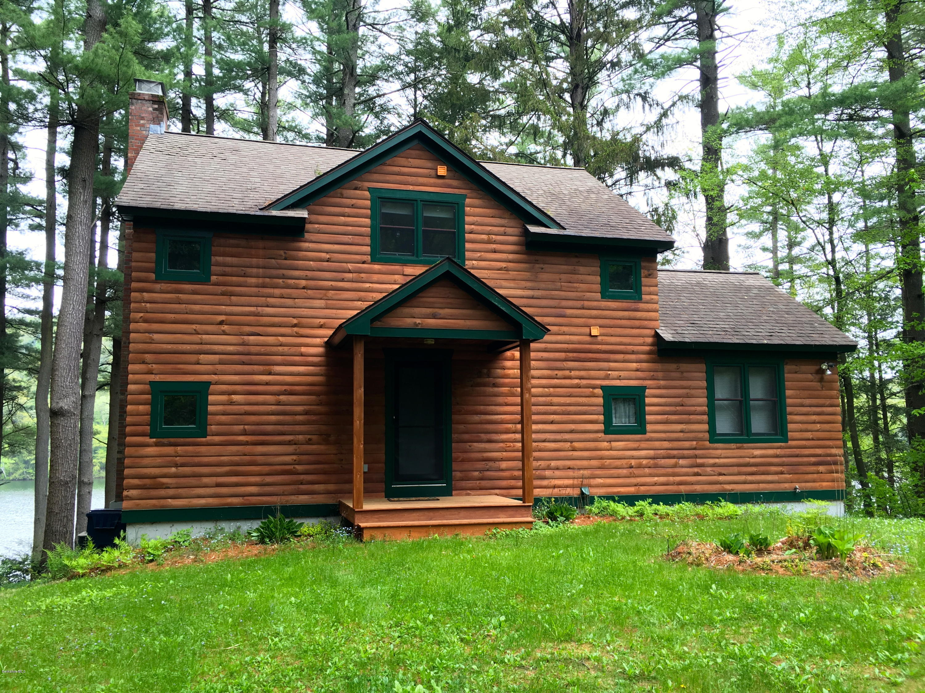 26 Bidwell Road Monterey, MA 01245 - Photo 1 of 17 a front view of a house with a yard