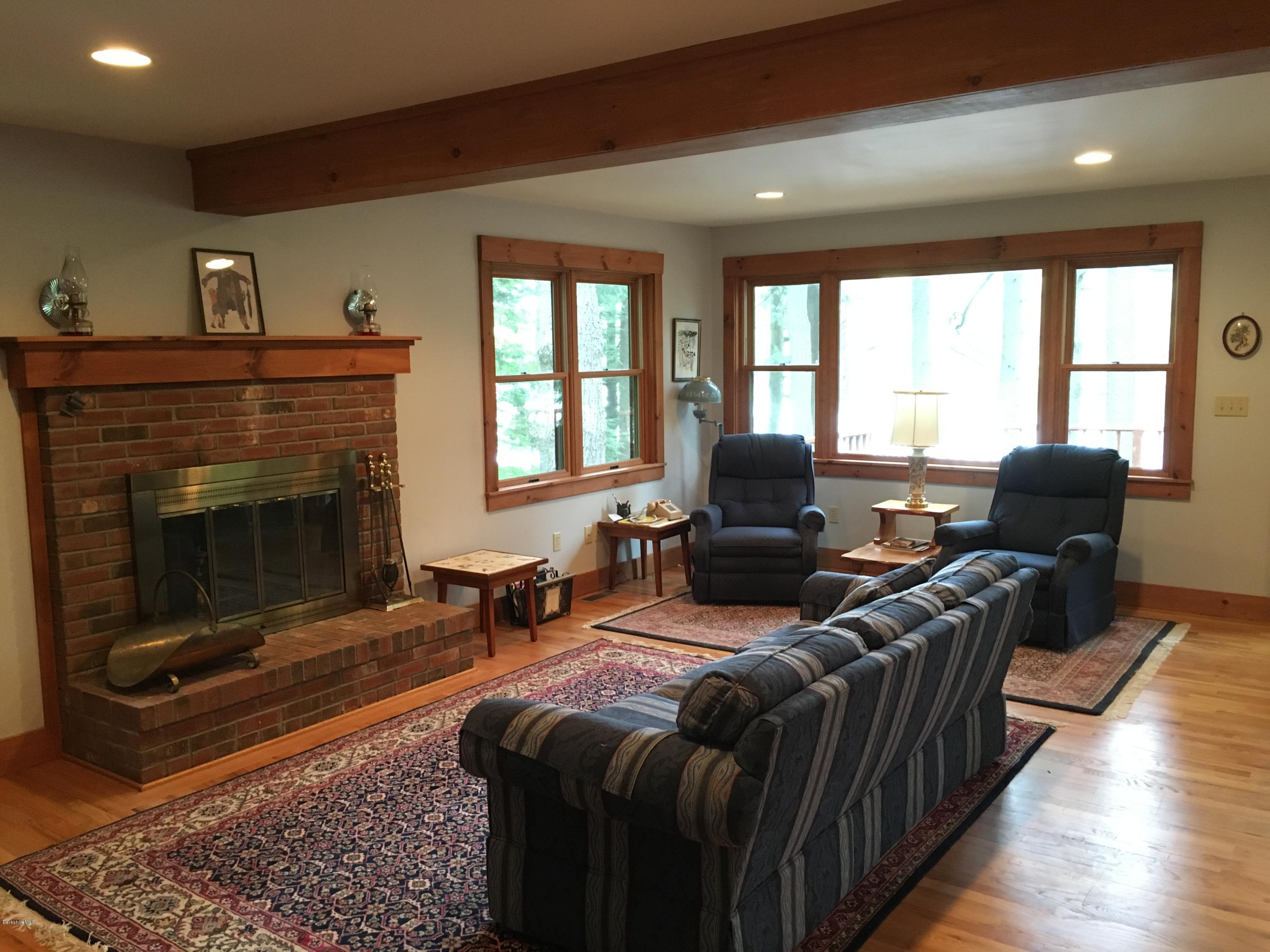 26 Bidwell Road Monterey, MA 01245 - Photo 2 of 17 a living room with furniture fireplace and flat screen tv